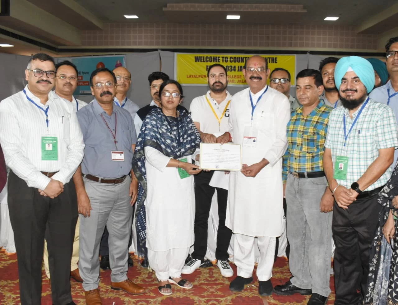 Mahendra bhagat receives the certificate from returning officer alka kalia after winning the jalandhar west by-election